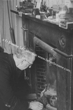 FRANK BROWNE AT THE FIREPLACE